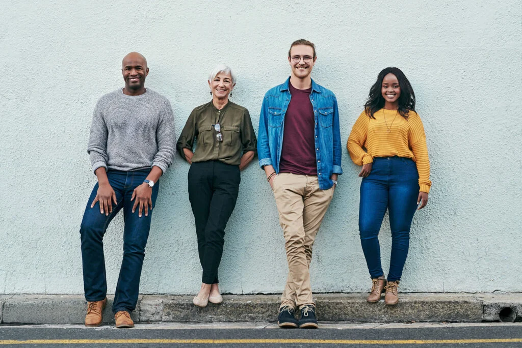 A group of church members standing together against a wall